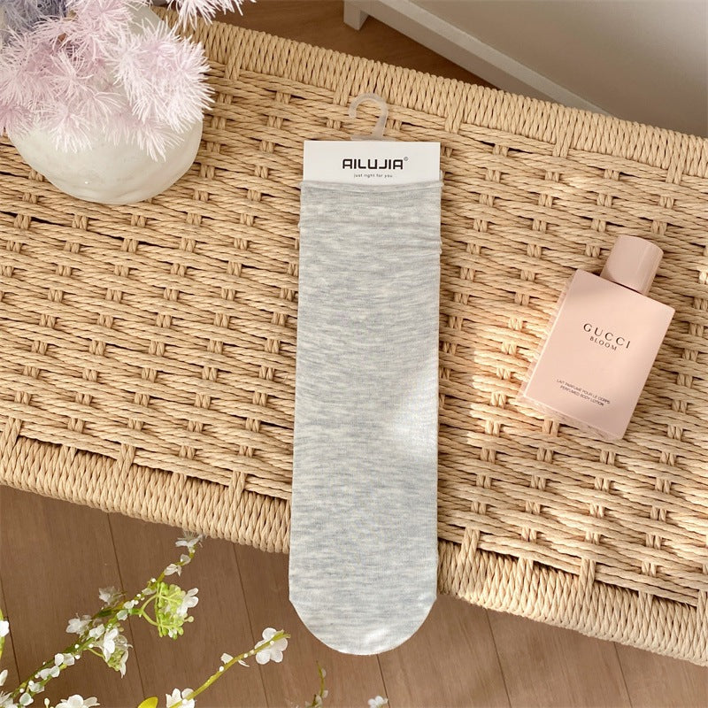 2025 spring and summer new college style classic solid color stacking socks breathable all-in-one machine boneless seam head medium tube women's socks