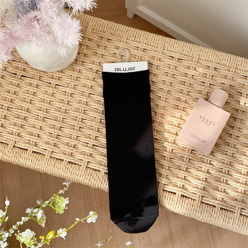 2025 spring and summer new college style classic solid color stacking socks breathable all-in-one machine boneless seam head medium tube women's socks